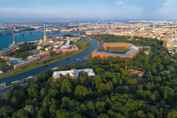 Peter and Paul Fortress and Kronverk in the cityscape on a warm July morning (aerial photography). Saint-Petersburg, Russia