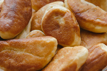 Lots of homemade pies on a big plate | EKATERINBURG, RUSSIA - 10.04.2020.