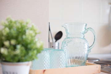 Empty Glass bottle of water with drinking glass  on the table in kitchen