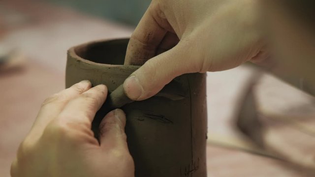 the work of a ceramist. making pottery