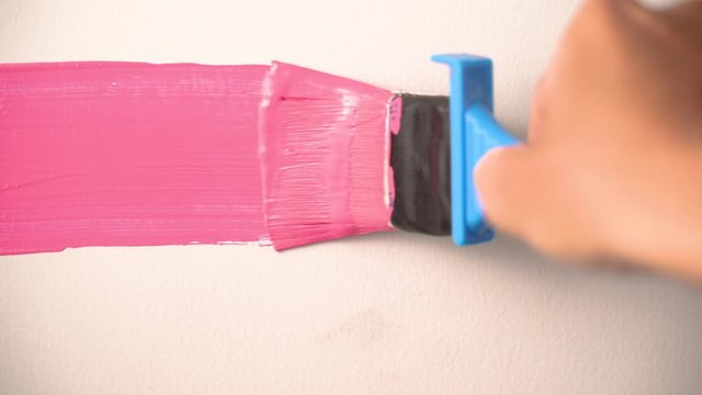hand paint the wall pink close up