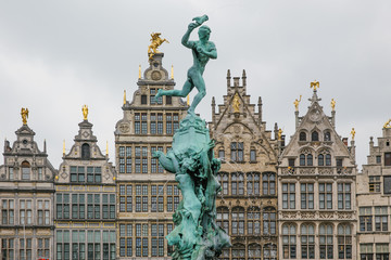 Fototapeta na wymiar May 2019 - Antwerp, Belgium - Statue of Brabo and the giant's hand with traditional buildings facades in background at Grote Markt in the center of Antwerp.