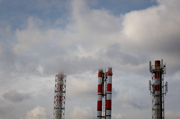 smokestacks smoke the ecology of the city is dying cold steam pollution the city is in smoke the ecology is broken. white smoke