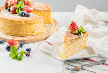 Happy birthday fresh fruit cheese cake with Happy birthday on cake concept with strawberry kiwi fruit cake. Food concept.