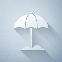 Paper cut Sun protective umbrella for beach icon isolated on grey background. Large parasol for outdoor space. Beach umbrella. Paper art style. Vector Illustration © Vadim