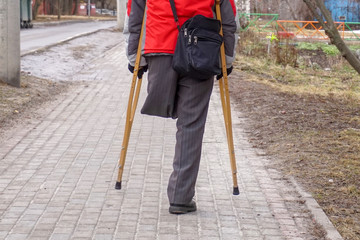     One leg and two crutches - disability concept.