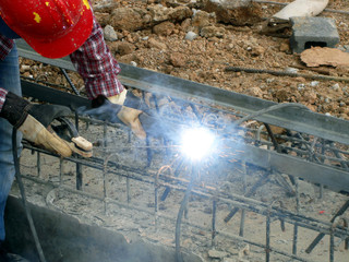 Welding work ,worker with protective welding metal on construction