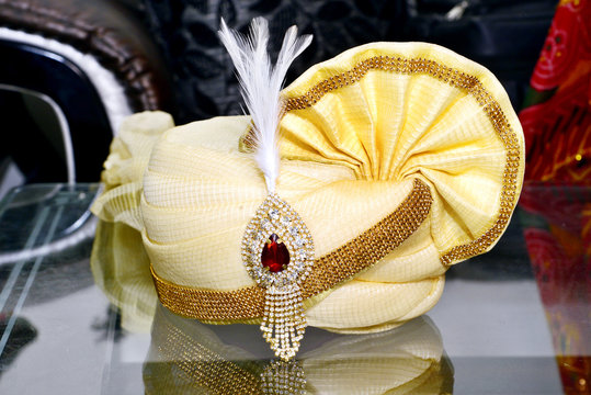 The wedding turban of an Indian groom, decorated with gold and gems.