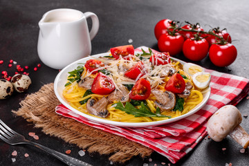 Spaghetti with mushrooms, cheese, spinach, rukkola and cherry tomatoes