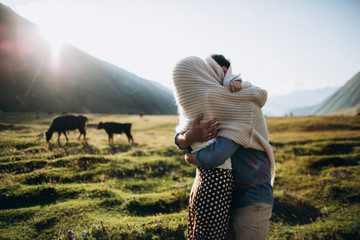 Loving couple on their engagement photoshhot in mountains