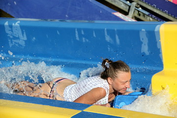 The girl has fun at the water Park