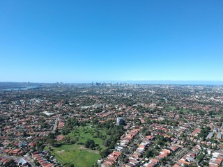 Drone panoramic aerial view of Sydney NSW Australia city Skyline and looking down on all suburbs 