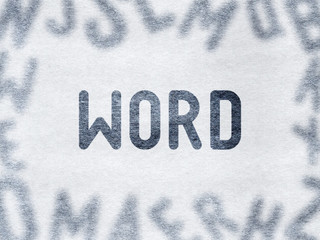 WORD - Word on paper surrounded by blurry letters