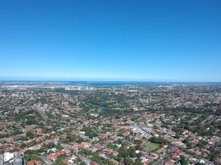 Drone panoramic aerial view of Sydney NSW Australia city Skyline and looking down on all suburbs 