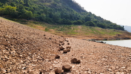 Cracked soil nearby the river.