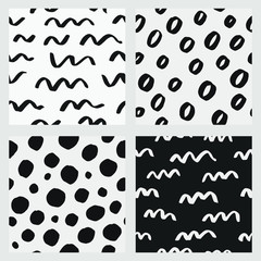 Abstract hand drawn vector seamless pattern set. Black and white backgrounds with circles and waves, monochrome repeat pattern	