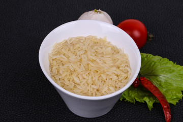 Raw uncooked rice in the bowl
