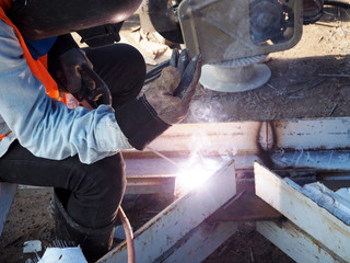 Welding work ,worker with protective welding metal on construction