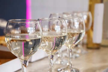 three glasses with white wine