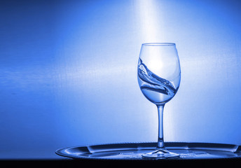 cold water spills out of a glass