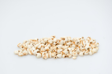 millet in a wooden bowl isolated on white