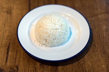 Fototapeta na wymiar Cooked Jasmin Rice On white plate.