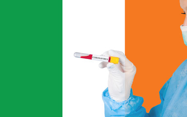 Coronavirus or Covid-19 in Ireland, sample blood tube in nurse hand with Ireland flag on background. Coronavirus Chinese infection.
