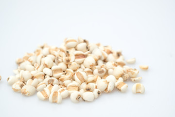 millet in a wooden bowl isolated on white