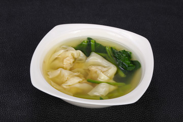 Asian traditional Wonton soup with herbs