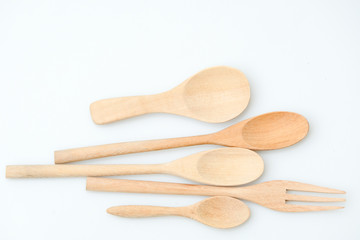 wooden spoon and fork on pastel color background