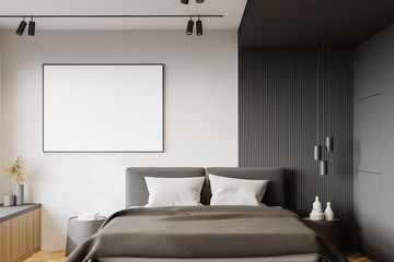 White and gray bedroom interior with poster