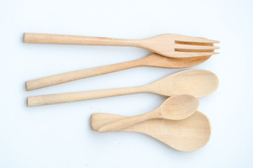 wooden spoon and fork on pastel color background