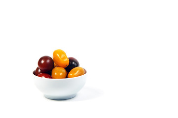 a bowl of Cherry-tomatoes isolated on white background. Horizontal image