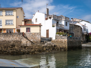 Fototapeta na wymiar Village houses in th harbor of Redes, Ares, Galicia, Spain