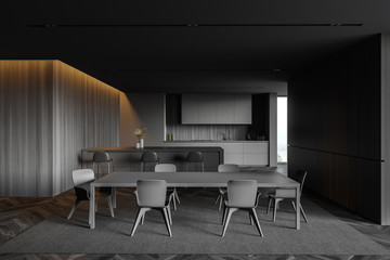Gray and wooden kitchen with bar and table