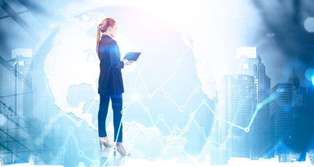 Woman with laptop in city, graph and planet