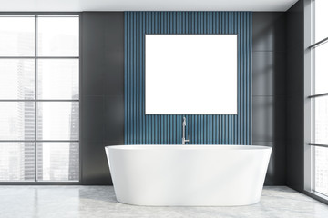 Fototapeta na wymiar Gray and blue bathroom with tub and poster