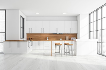 White and wooden kitchen interior with bar