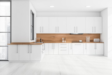 White and wooden kitchen interior with countertops