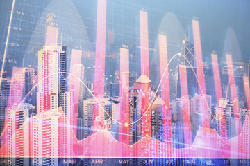 Forex chart on cityscape with skyscrapers wallpaper double exposure. Financial research concept.