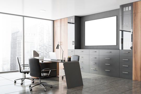 Gray and wooden CEO office corner with poster