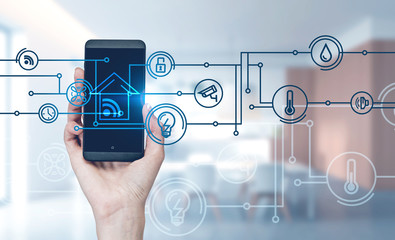 Woman hand with phone in kitchen, smart home icons