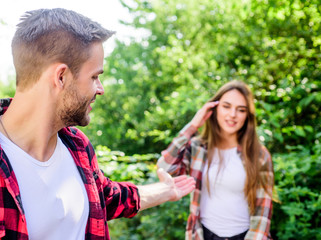 Fototapeta premium follow me. happy valentines day. summer camping in forest. man in selective focus with girl in park. couple first meet outdoor. Relations. family weekend. romantic date. couple in love