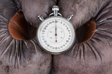 old boxing gloves with stopwatch