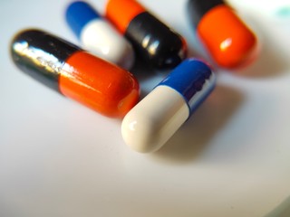 Photo of capsules on white background. Medicine capsules photo. Drugs for human. 