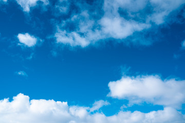 Blue sky in the soft white clouds. Natural cloudscape background, texture. Wide Horizontal Wallpaper With Copy Space.