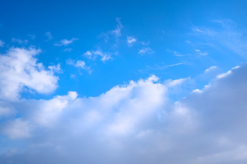 Blue sky in the soft white clouds. Natural cloudscape background, texture. Wide Horizontal Wallpaper With Copy Space.