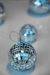 glitter balls on a table, only one in focus