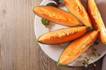 melon slices on plate- top view