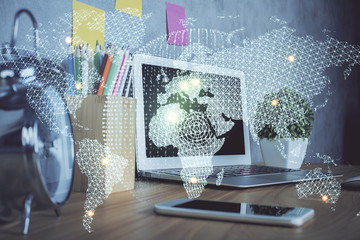 Double exposure of business theme icons and work space with computer background. Concept of success.